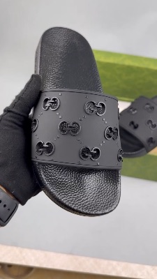 Gucci women's GG rubber slides in black — 5