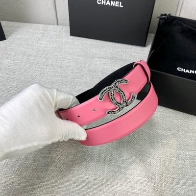 Chanel leather belt features a vibrant pink strap paired with a gold-tone CC buckle — 7