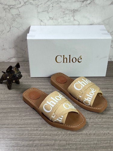 These are Chloé Woody sandals featuring beige logo-embroidered canvas crossover straps — 4