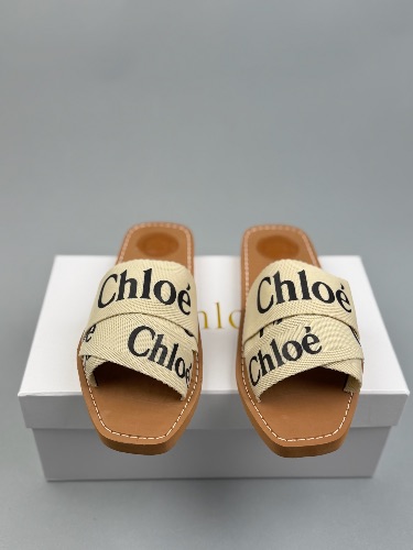 Chloé Woody flat sandals in a white and beige canvas colorway — 3