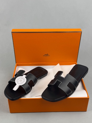 Hermès Oran sandals in black leather