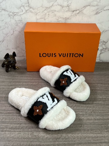 Louis Vuitton shearling-covered slippers