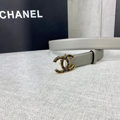 Chanel grey leather belt featuring a distinctive patterned silver-tone CC logo buckle — 7