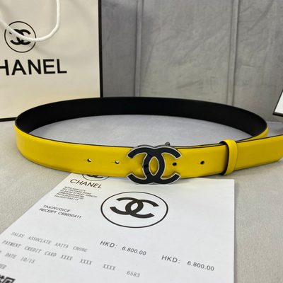 Chanel belt features a vibrant yellow leather strap and a distinctive black and gold CC logo buckle — 4