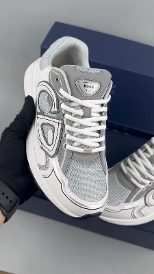 Dior B30 grey and white sneakers featuring a reflective CD signature — 5