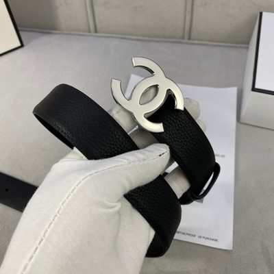 Chanel black leather belt featuring a prominent gold-toned interlocking CC logo buckle — 6