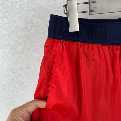 Moncler logo patch swim shorts in red — 6