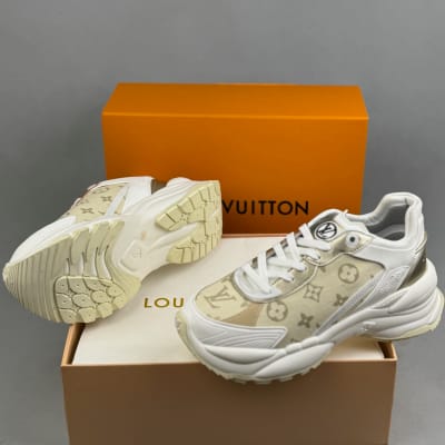 Louis Vuitton Run 55 sneakers in a white and gold monogram canvas design