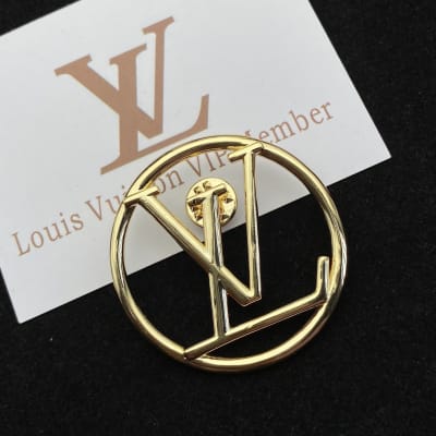 Louis Vuitton LV initials logo inside a circle — 4