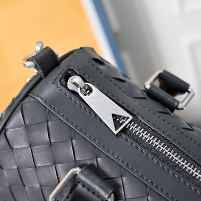 Bottega Veneta-style black woven Intrecciato leather pillow bag — 4