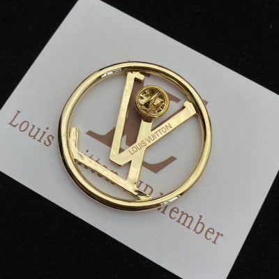 Louis Vuitton LV initials logo inside a circle — 5